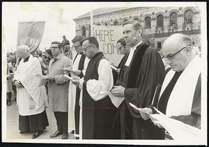 State Religious Leaders join in penitential "Stop Our Silence" rally in Copley Square yesterday. From left, Msgr. Matthew Stapleton, chairman of the Catholic archdiocese's ecumenical commission; Rev. Avery Post, United Church of Christ state executive; Rev. Arthur Walmsley of the Mass. Council of Churches; Episcopal Bishop John M. Burgess; the Rev. Burrett E. McBee, state executive for the United Presbyterian Church; and Rabbi Roland Gittelsohn of Temple Israel.