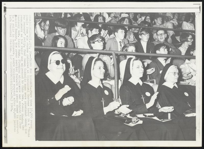 Teens for Decency--More than 10,000 young people from six states gathered at Cincinnati Gardens today in a "Teens For Decency" rally. Four Roman Catholic nuns were prominent among the youngsters as the rally was addressed by Ohio Gov. James Rhodes and Kentucky Gov. Louie Nunn. Pleding allegiance and singing the Star Sangled Banner, the group carried forward the peace theme in contrast to a rally in Baltimore, where violence erupted after 40,000 persons left Memorial Stadium.