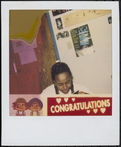 Young girl looking at photographs