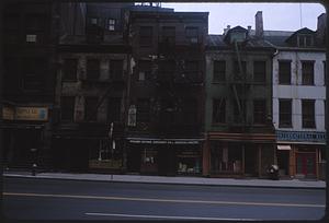 View across street of row of city buildings, likely Manhattan, New York