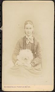 Unidentified woman holding a dog