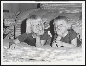 Who's Worried--Not the Tuepfer girls, Kati, 5, (left) and Liz, 3. These daughters of Mr. and Mrs. Tuepfer of New York City relaxed at Baker School, West Dennis.