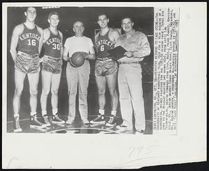 Kentucky Returns to Cage Scene--The University of Kentucky basketball team, idle for a year because of a suspension, opened practice for the 1953-54 season today. Three big cogs in the Wildcat machine are shown here, from left; Lou Tsioropuolos, senior forward from Lynn, Mass.; Frank Ramsey, Madisonwille, Ky., senior guard; Coach Adolph Rupp; Cliff Hagan, Owensboro, Ky., senior center, a unanimous All-America choice in 1951-52, and Asst, Coach Harry Lancaster.