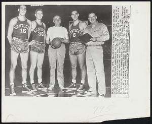 Kentucky Returns to Cage Scene--The University of Kentucky basketball team, idle for a year because of a suspension, opened practice for the 1953-54 season today. Three big cogs in the Wildcat machine are shown here, from left; Lou Tsioropoulos, senior forward from Lynn, Mass.; Frank Ramsey, Madisonville, Ky., senior guard; Coach Adolph Rupp; Cliff Hagan, Owensboro, Ky., senior center, a unanimous All-America choice in 1951-52, and Asst, Coach Harry Lancaster.