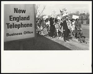 Newtonville, Mass. Group marches on AT+T business office to pay phone bills less taxes in protest to Vietnam war.
