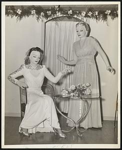 Alive--Although they look more like show window models, they are real live mannequins. Constance Hurley, left, and Shirley White, who will be seen in the brilliant Elizabeth Arden makeup fashion exhibition this afternoon at the William Filene's Sons Company.