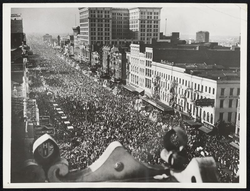 Fiesta Scene A view of the crowd-packed Canal Street where many of the half-million spectators massed to witness the parade of floats on both sides of the thoroughfare as Rex, King of the Mardi Gras, invaded New Orleans on March 1 to the acclaim of a festive populace.