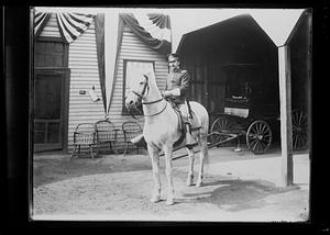 Soldier on white horse