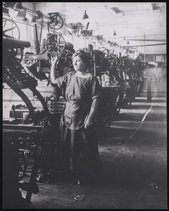 Marie Lingier (Belgian) at wheel of textile machinery, c. 1912