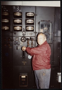 Lower Pacific Mills. Jim McGregor, maintenance man (36 yrs employed) at main power switch to #3 generator