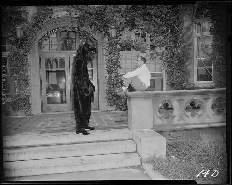 Bear and man in front of Alumni Hall