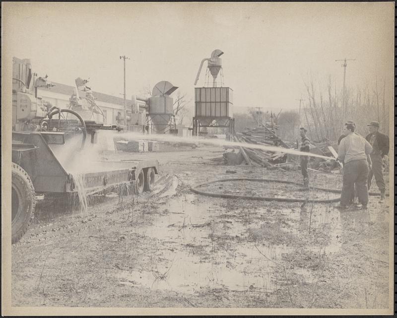 Man Hosing Equipment At Clark-aiken - Digital Commonwealth