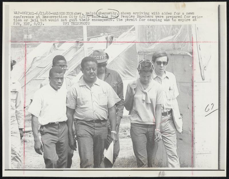 Rev. Ralph Abernathy, shown arriving with asides for a news conference at Resurrection City 6/23, said his Poor Peoples Marchers were prepared for eviction or jail but would not guit their encampment. The permit for camping was to expire at 8 PM, EDT, 6/23.