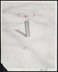 Two-Foot Ruler nearly disappears when plunged into the snow on a level part of Boston Common. The ruler, placed at a point where there was no drifting, shows the snow was 19 inches deep.