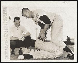 "Twins Camp" - The Minnesota Twins Spring training camp opening was delayed until Saturday, but these three get going early with exercise. Bob Allison watches Jim Kaat, on the ground, while Don Lee does the work.