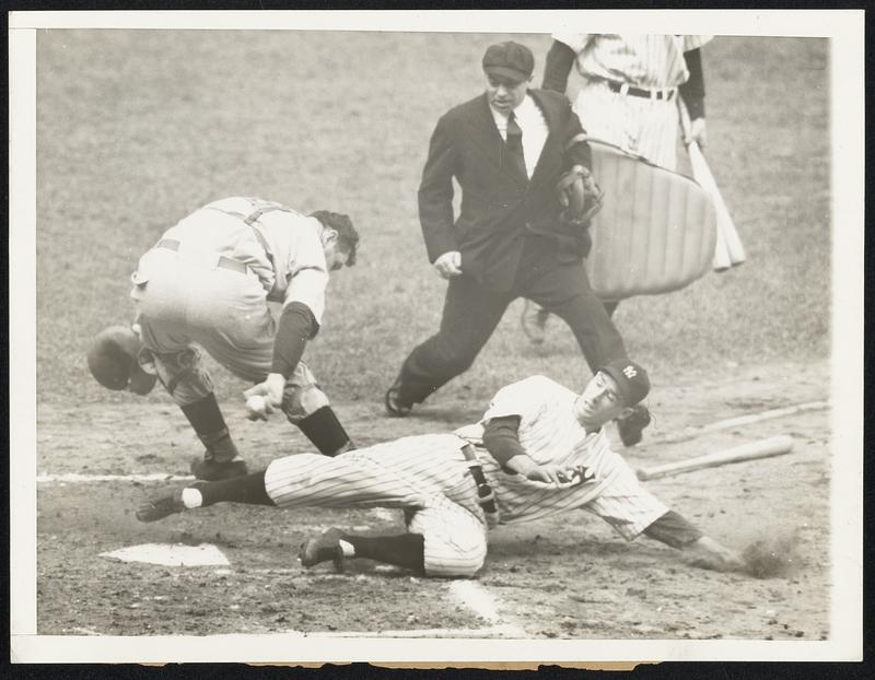 Ties the score -- Here's World Series drama for you, that moment in the fifth inning when Yankee second baseman Joe Gordon beat the ball to the plate, tieing the score with the Cincinnati Reds. Lombardi's reach is just not far enough; the umpire is Bill McGowan. The Yankees took the series opener, 2-1, in New York