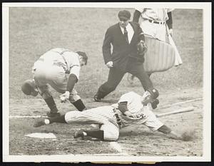 Ties the score -- Here's World Series drama for you, that moment in the fifth inning when Yankee second baseman Joe Gordon beat the ball to the plate, tieing the score with the Cincinnati Reds. Lombardi's reach is just not far enough; the umpire is Bill McGowan. The Yankees took the series opener, 2-1, in New York