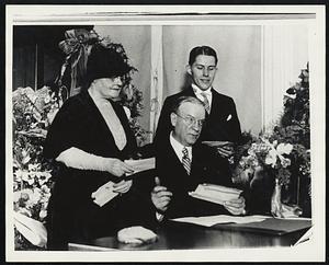Mayor Mansfield at desk in City Hall, with Mrs. Mansfield and son+E897 Walter.