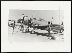 Eyes of The Army supervise plane production as troops opened the struck plant of North American Aviation in Inglewood, Cal. Two of the mechanics here resume work on an army training plane.