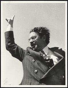 Unidentified man holding up a 'V' peace sign