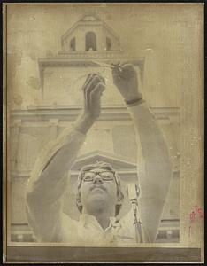 Jerry J. Coffin, of Los Angeles, Cal., burns his draft card in front of historic Independence Jail in Philadelphia 10/16. Coffin was one of several men to burn their draft card. Others sort their intact to the selective service system. The anti- Vietnam war demonstration was one of several around the country.