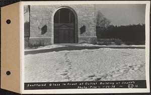 Contract No. 25, Superstructure, Wachusett Outlet Works Building, Shaft 1, Wachusett-Coldbrook Tunnel, West Boylston, scattered glass in front of outlet building at Shaft 1, West Boylston, Mass., Jan. 26, 1938