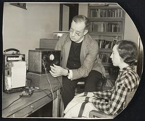 Lie detector, invented by the Rev. Walter G. Summers, head of the department of psychology at the Fordham Graduate School and used on Major Greene before he confessed the murder of Mrs. Mary Case in her New York apartment. Above: Fr. Summers demonstrating the device, which employs silver contacts on the subject's hands to enable the electricity of the human body to be utilized to show emotional changes. At right: Close-up of contacts, and (below) a guilty "verdict."