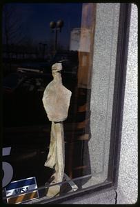 A sculpture in a window display