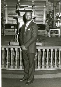 St. Paul AME, Ken Reeves standing in front of pulpit, Oct. 1983