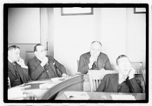 Group of men at table