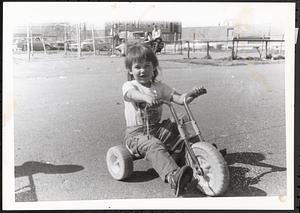 Young child on a tricycle