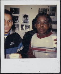 Two boys holding cups