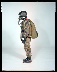AMEL basic military free fall parachute system on jumper, side view