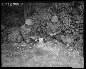 Food lab, new meal, ready to eat, out in field with GI opening pack & heating food