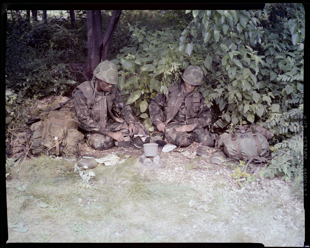 Food lab, new meal, ready to eat, out in field with G.I. opening food pack