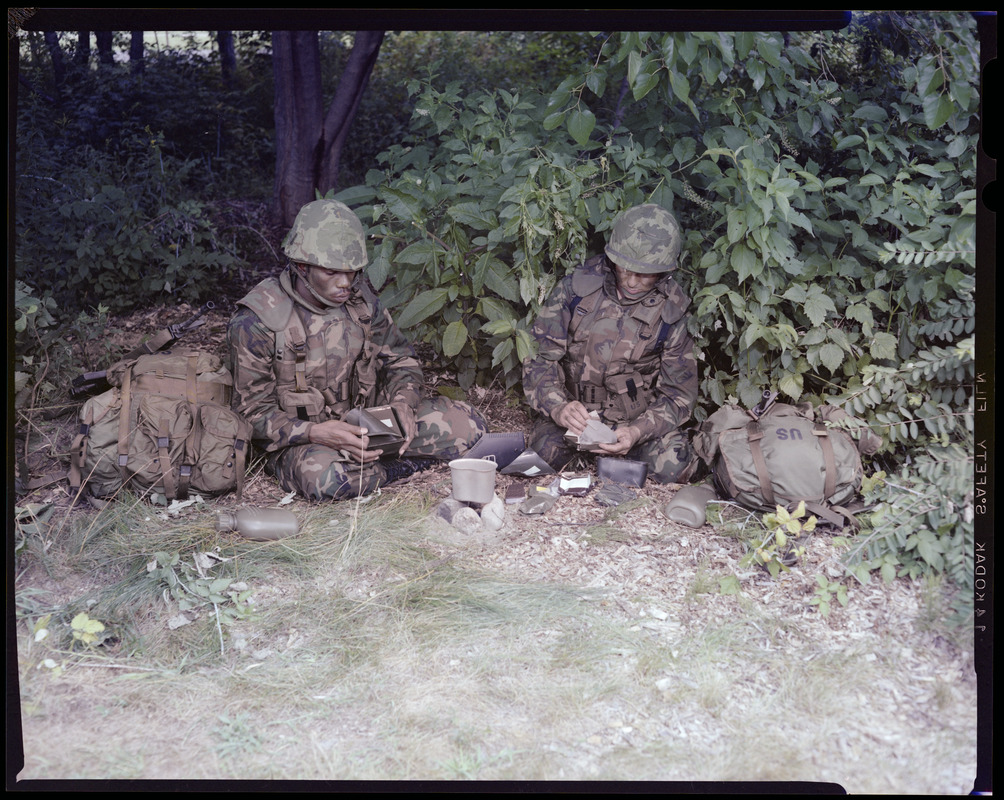 Food lab, new meal, ready to eat, out in field with G.I. opening food pack