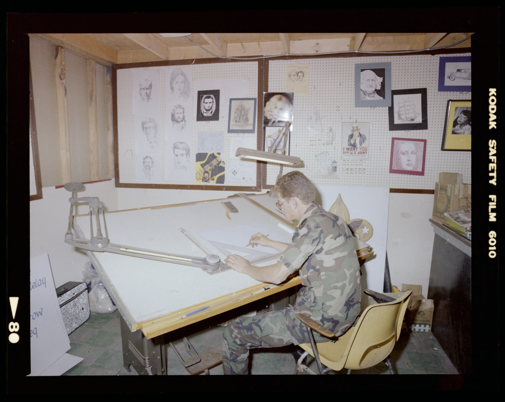 Man drawing at drafting table