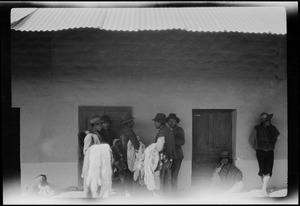 Peru, on the journey from Mollendo to Arequipa, Indians selling llama and alpaca skins at the station