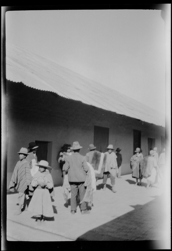 Peru, on the journey from Mollendo to Arequipa, Indians selling llama and alpaca skins at the station