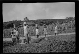 Barbados, British West Indies, children getting water at a wayside government tap, Bathsheba
