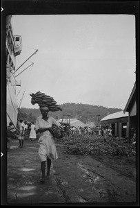 St. Lucia, B. W. I., girls loading bananas for U. S. A., salary a penny for each stalk or bunch
