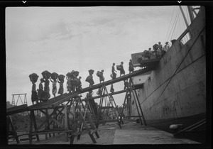 Island St. Lucia, British West Indies, girls and young men unloading coal