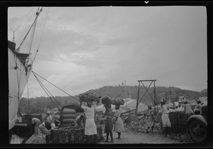 St. Lucia, B. W. I., native girls loading bananas on to S. S. Lady Drake for United Fruit Co. U. S. A.
