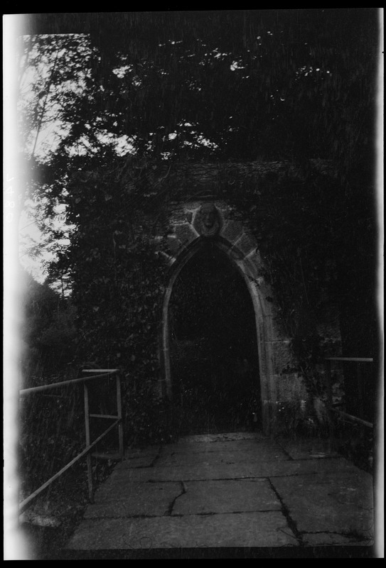 Garden of Cong Abbey, Co. Mayo, head of a monk sculpture over the gateway