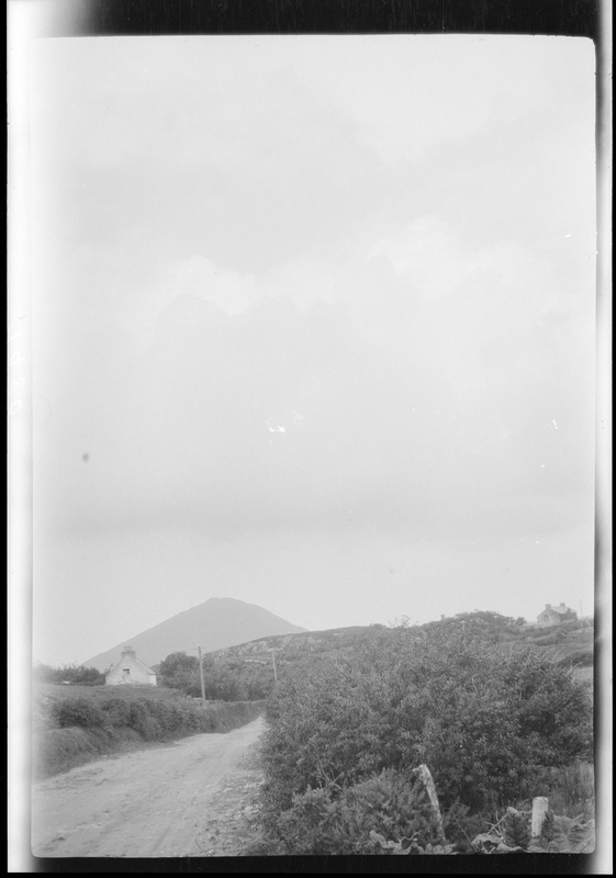 A road in Connemara, Ireland, one of the "Twelve Pins" in the distance