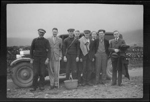 The men from the Blasket Islands with the students who are going to the Islands to perfect their Irish?! Mr. O'Reilly of London is at the right of the group. His son is second from the left