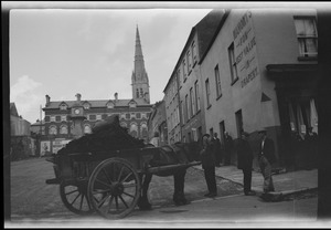 Carts with turf in the square at Letterkenny, Co. Donegal, showing the cathedral in the distance