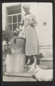 Gracie MacCormack with Biddy the mother dog and "Yo Yo" the puppy in the vase, Dun Emer