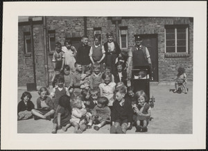 The caretaker of St. Ultan's "Flats" and the children who live there