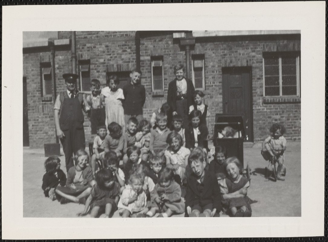 The caretaker of St. Ultan's "Flats" and the children who live there